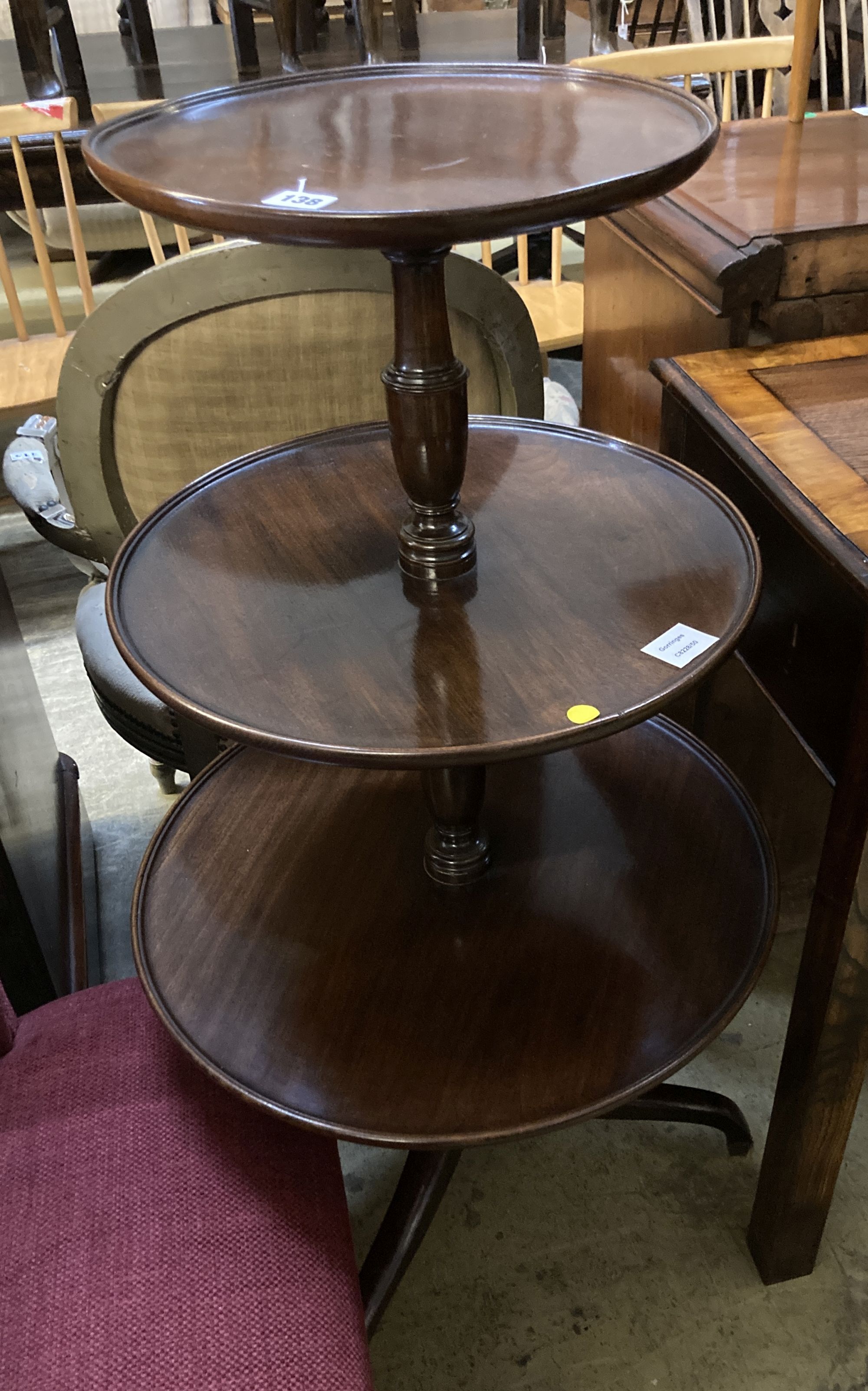 A George III and later mahogany three tier dumb waiter, 54cm diameter, height 108cm